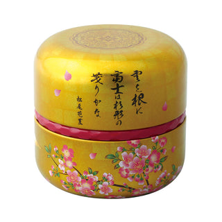 Teedose Fuji Kogane mit japanischer Kalligrafie und rosa Blüten auf goldenem Hintergrund